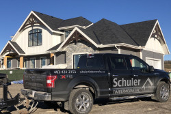 Photo: Large timber frame home and Schuler TImberworks truck in Large Timber Frame Homes