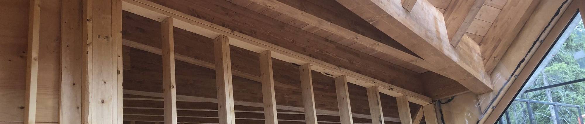 Hybrid timber frame construction with glulam beams and stick frame walls